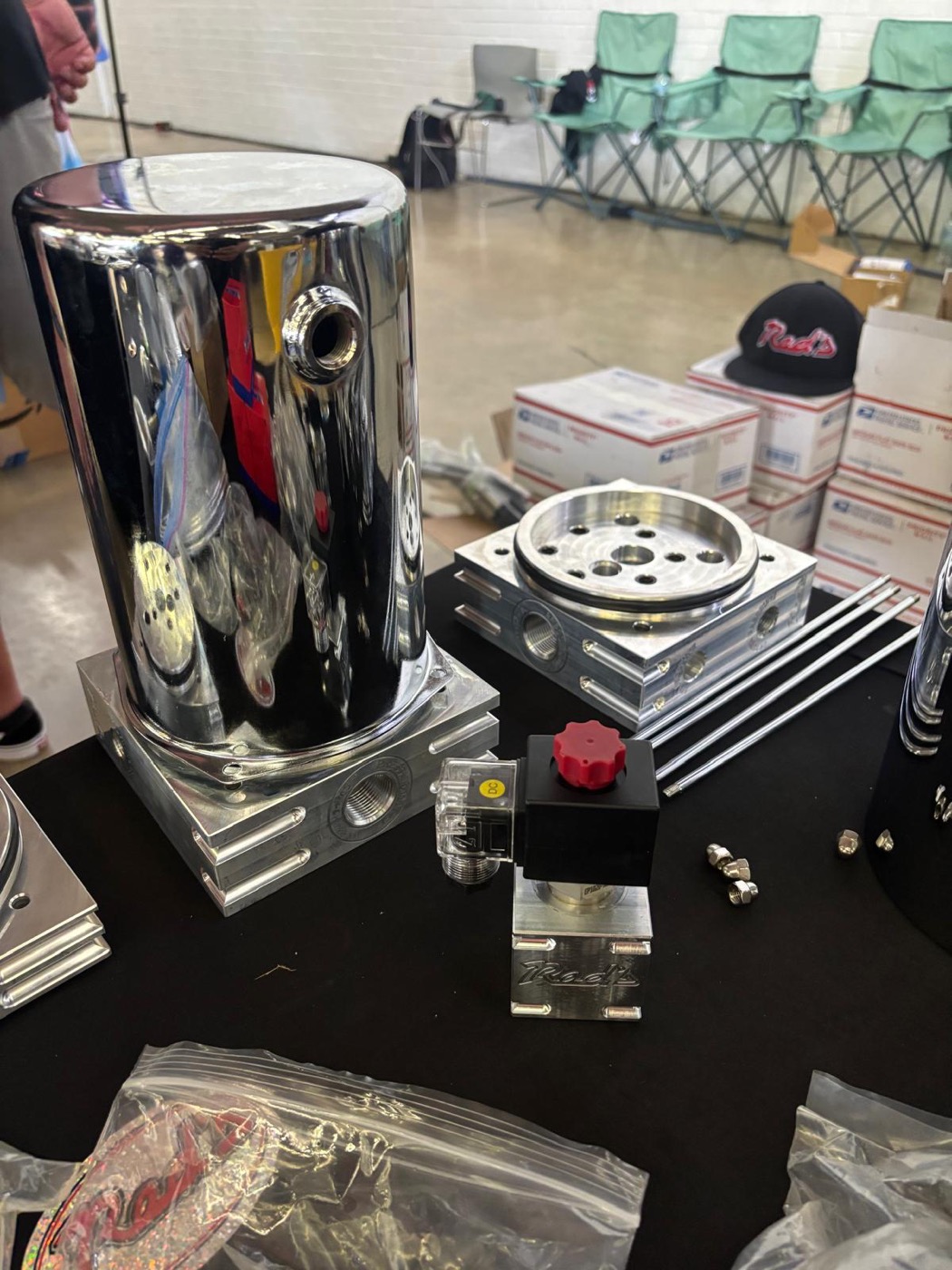 Chrome Red's Miami hydraulic cylinder displayed at a SEMA booth