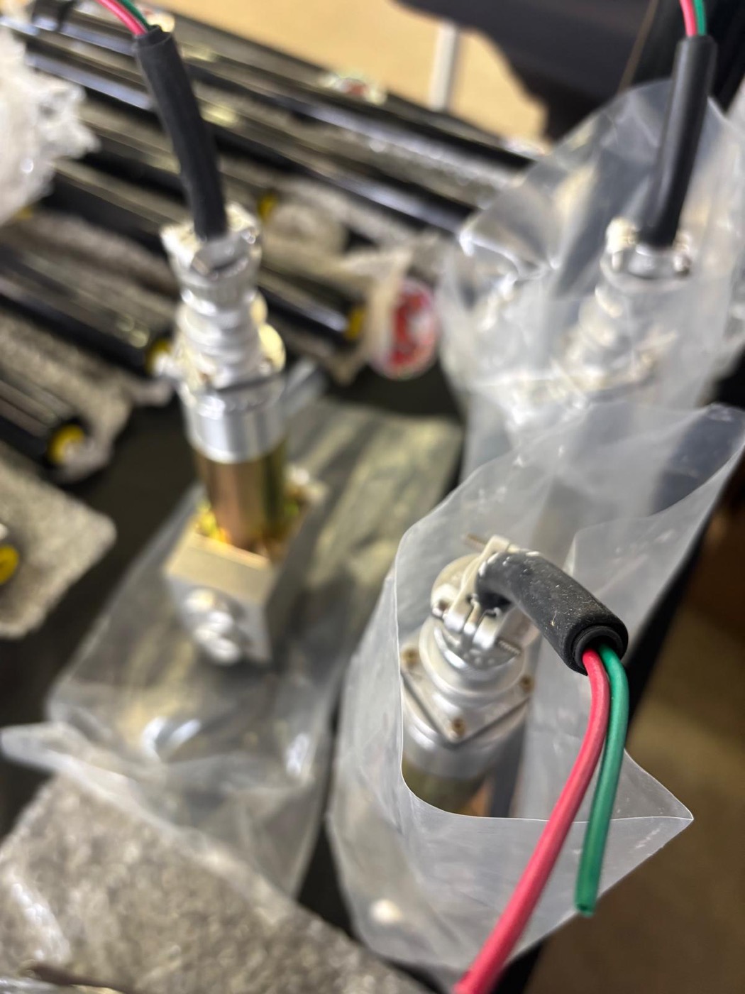 Close-up of Red's Miami hydraulic fittings and wiring at the Texas Auto Show display