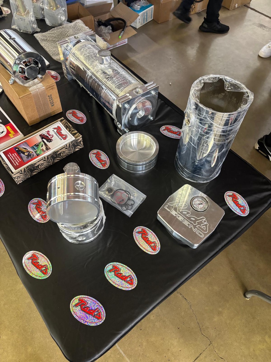 Red's Miami stickers and polished hydraulic products displayed at the Texas Auto Show